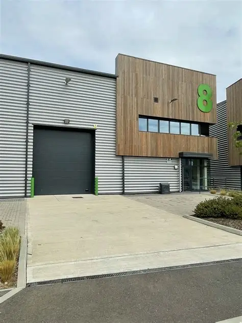 SMXi’s office at Unit 8, Halo Business Park, with timber cladding, a green number 8 and a glazed entrance.